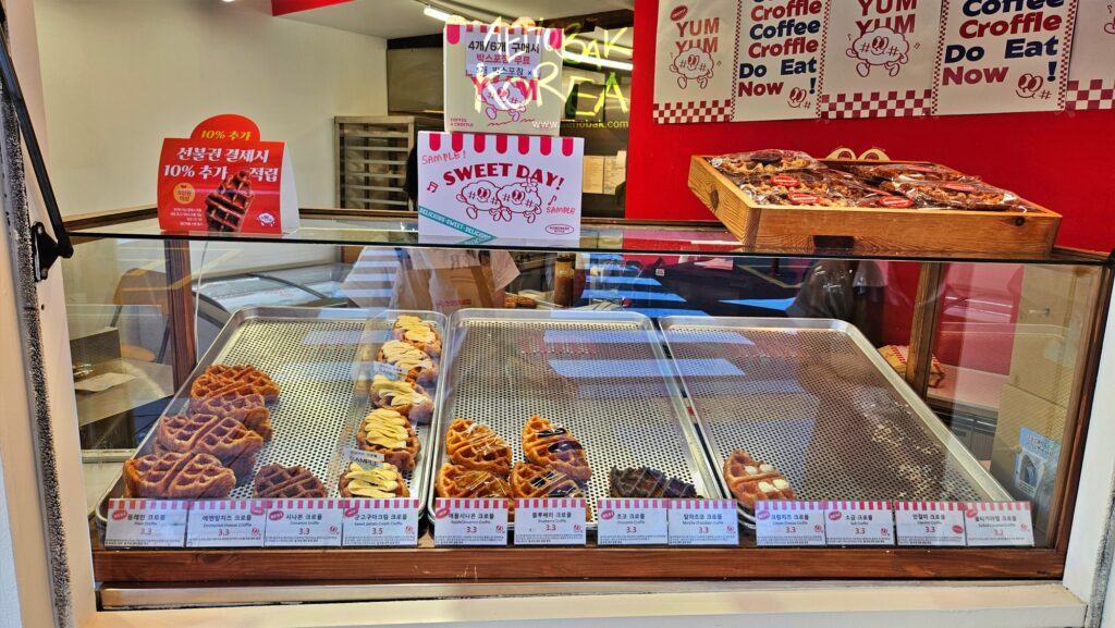 Displayed Croffle menu with various toppings – a must-try Korean dessert in Seoul cafés